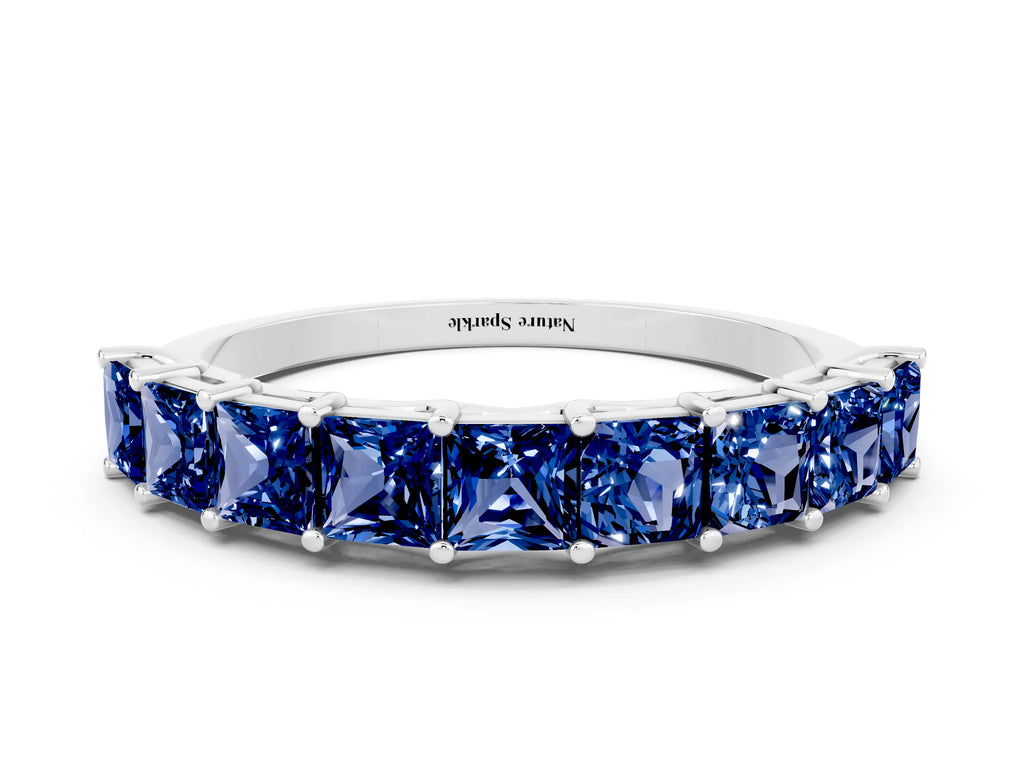 Princess Cut Blue Sapphire Eternity Band in White gold with Channel Setting and Prong Detail
