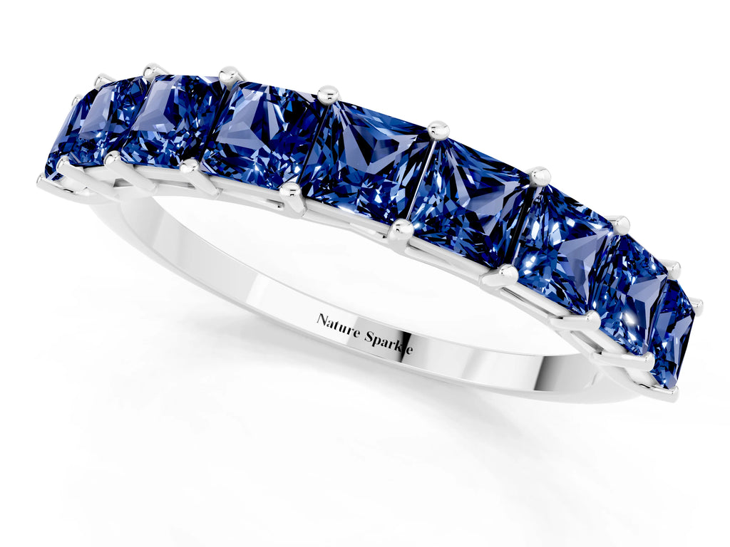 Princess Cut Blue Sapphire Eternity Band in White gold with Channel Setting and Prong Detail