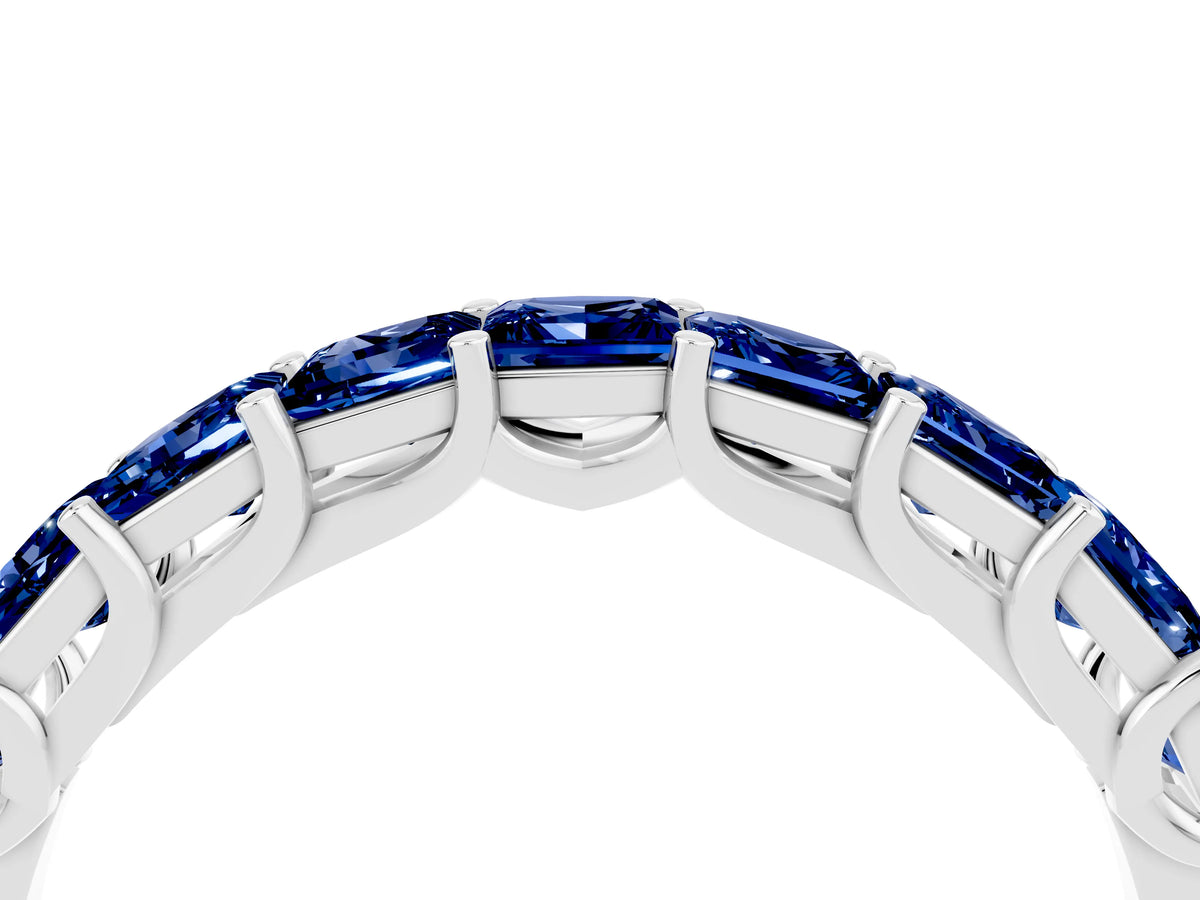 Princess Cut Blue Sapphire Eternity Band in White gold with Channel Setting and Prong Detail