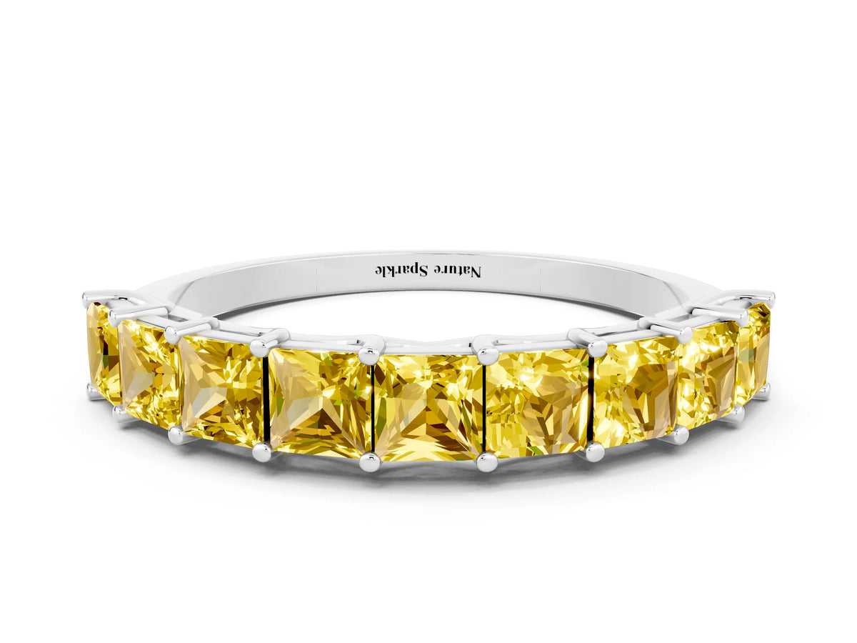 Princess Cut Yellow Sapphire Eternity Band in Silver with Channel Setting and Prong Detail