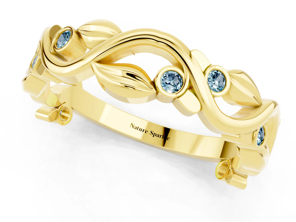 Round Aquamarine Leaf Motif Eternity Band in Yellow gold with Bezel Setting