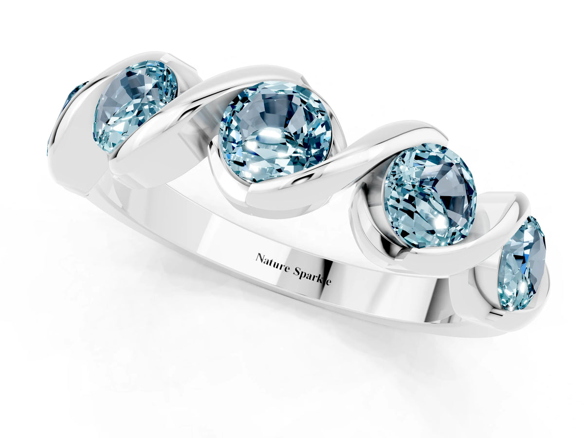 Round Aquamarine Wave Band in White gold with Channel Setting and Shared Prongs