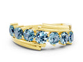 Round Aquamarine Wave Band in Yellow gold with Channel and Shared Prong Setting