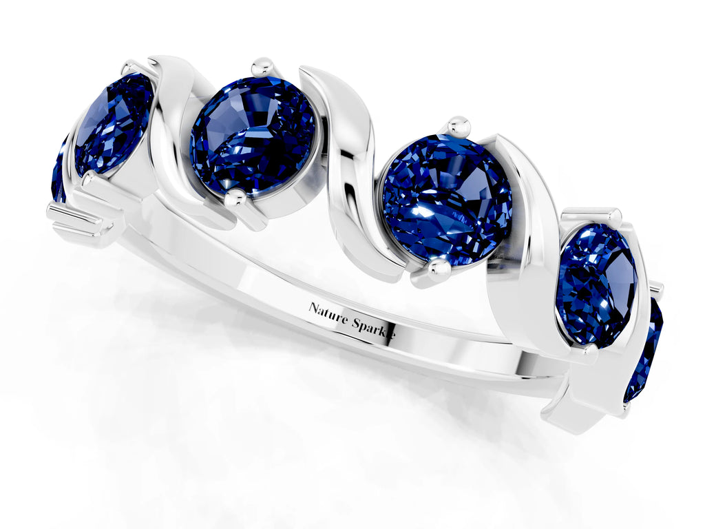 Round Blue Sapphire Half Eternity Band in Platinum with Wave Prong Setting