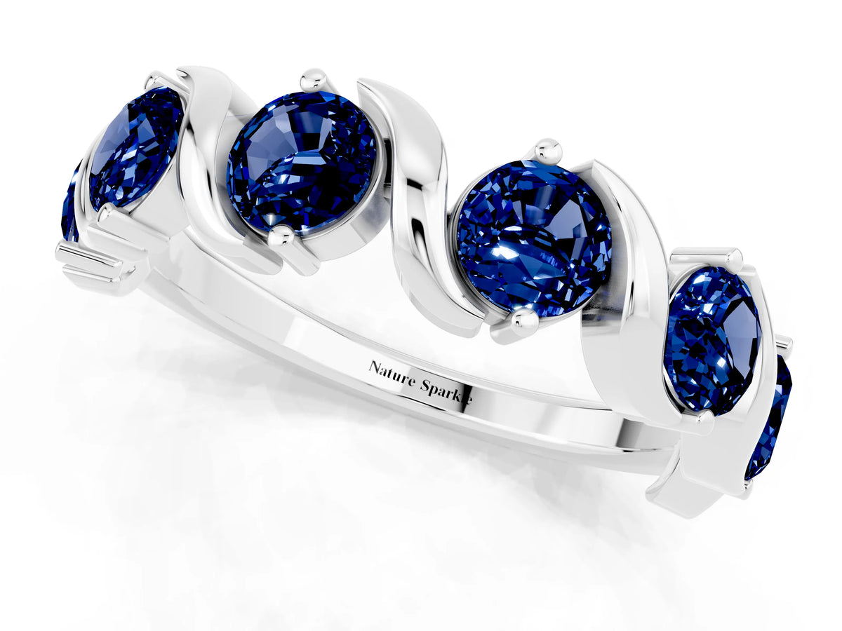 Round Blue Sapphire Half Eternity Band in Platinum with Wave Prong Setting