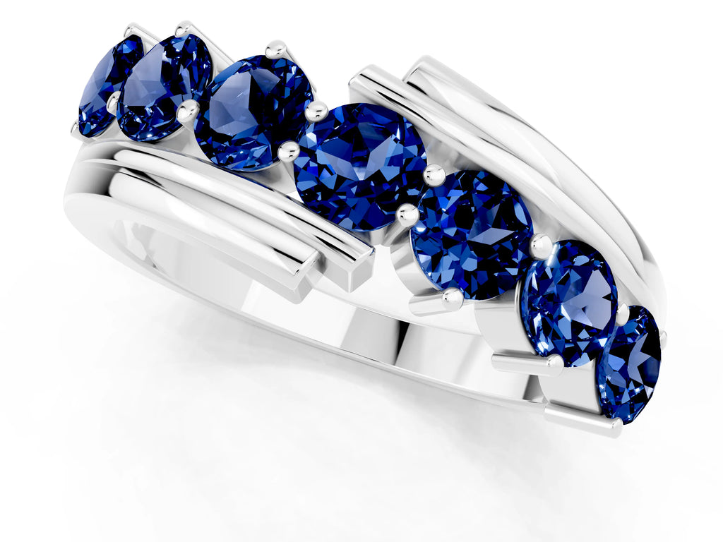 Round Blue Sapphire Wave Band in Silver with Channel and Shared Prong Setting