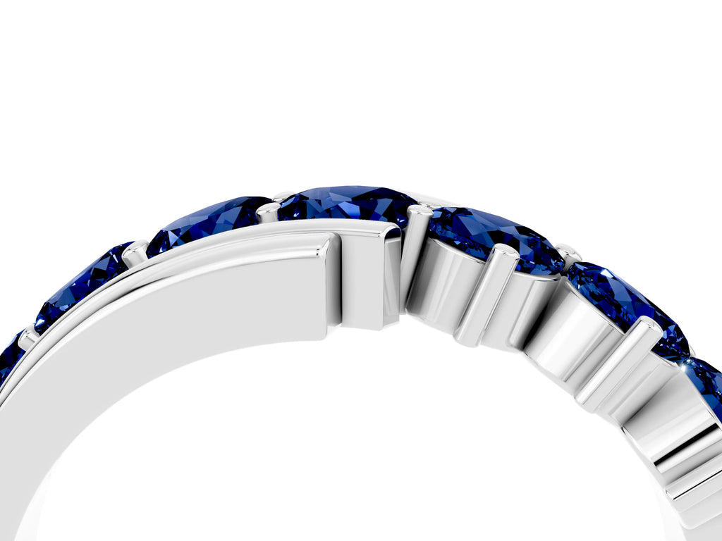 Round Blue Sapphire Wave Band in Silver with Channel and Shared Prong Setting
