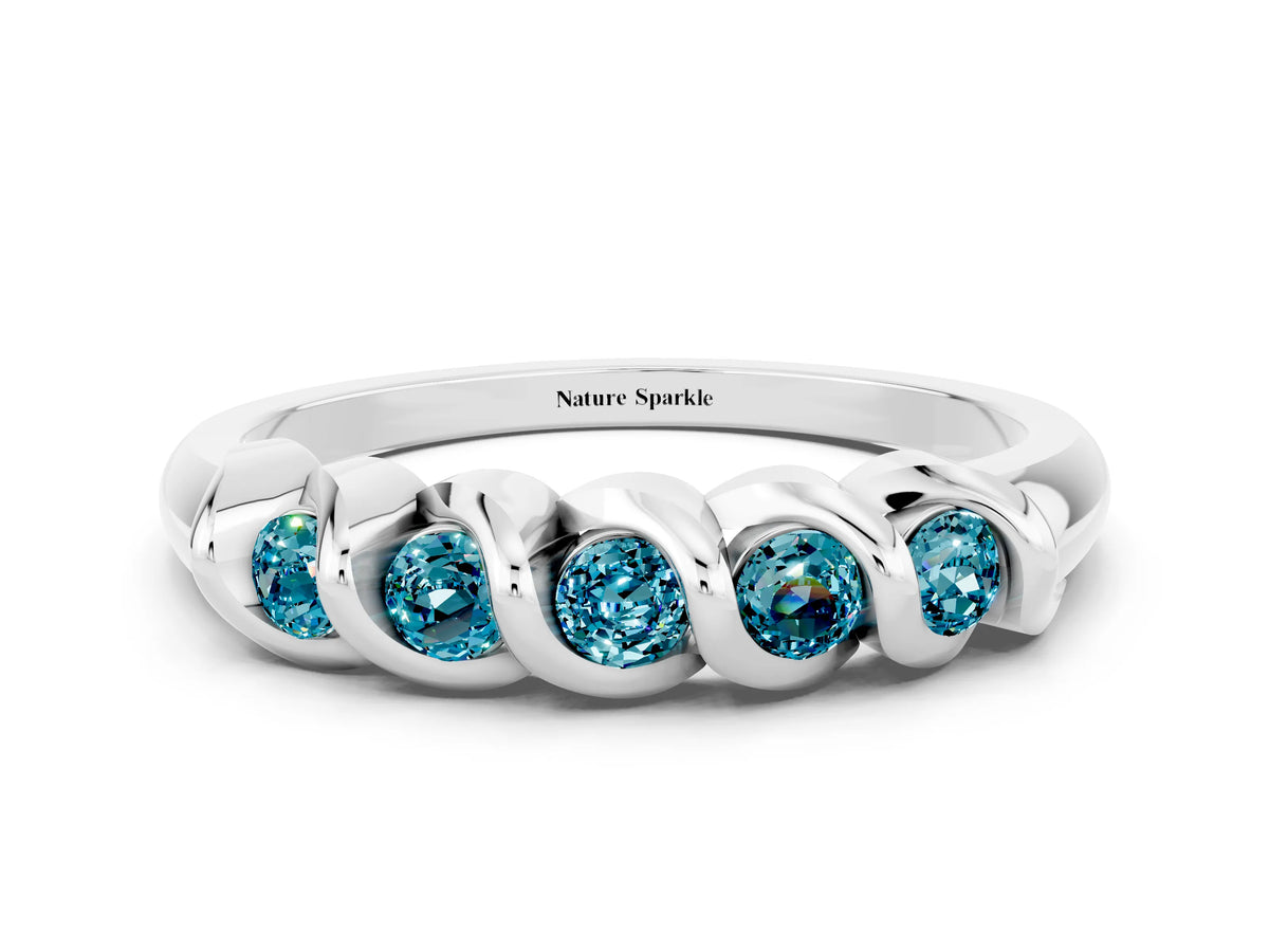 Round Blue Topaz Eternity Band in Silver with Twist Prong Setting