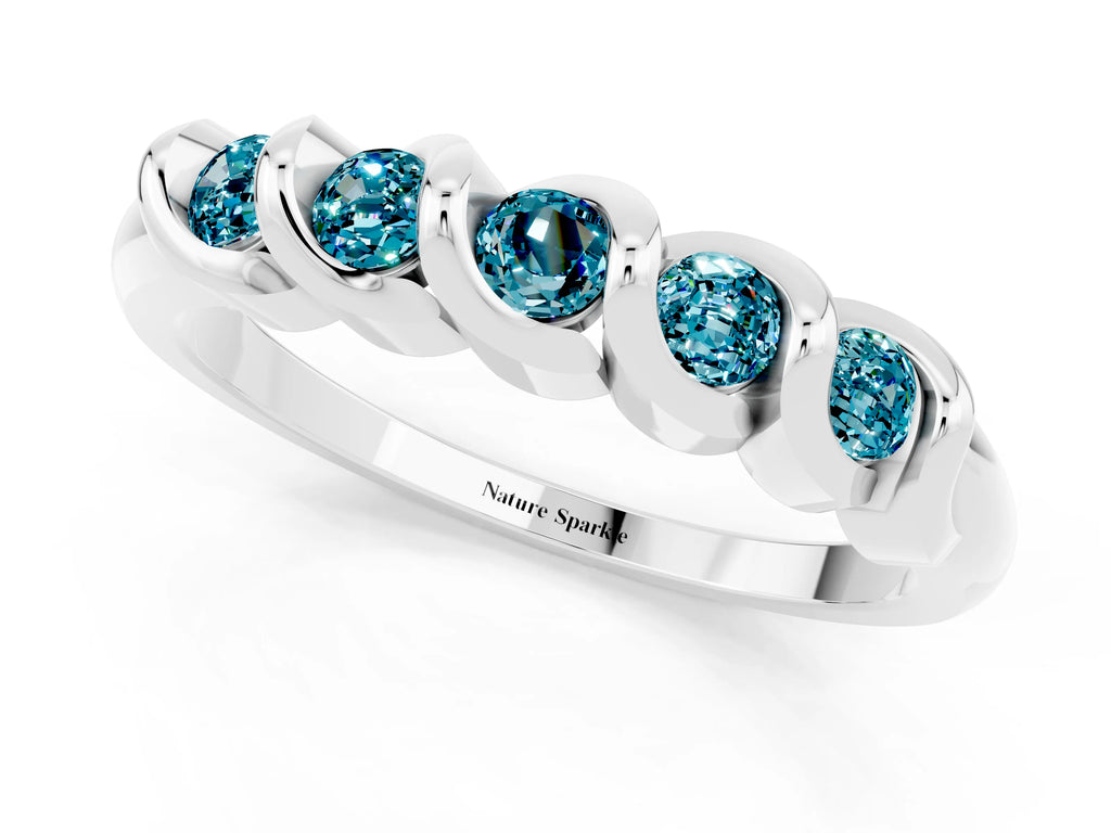 Round Blue Topaz Eternity Band in Silver with Twist Prong Setting