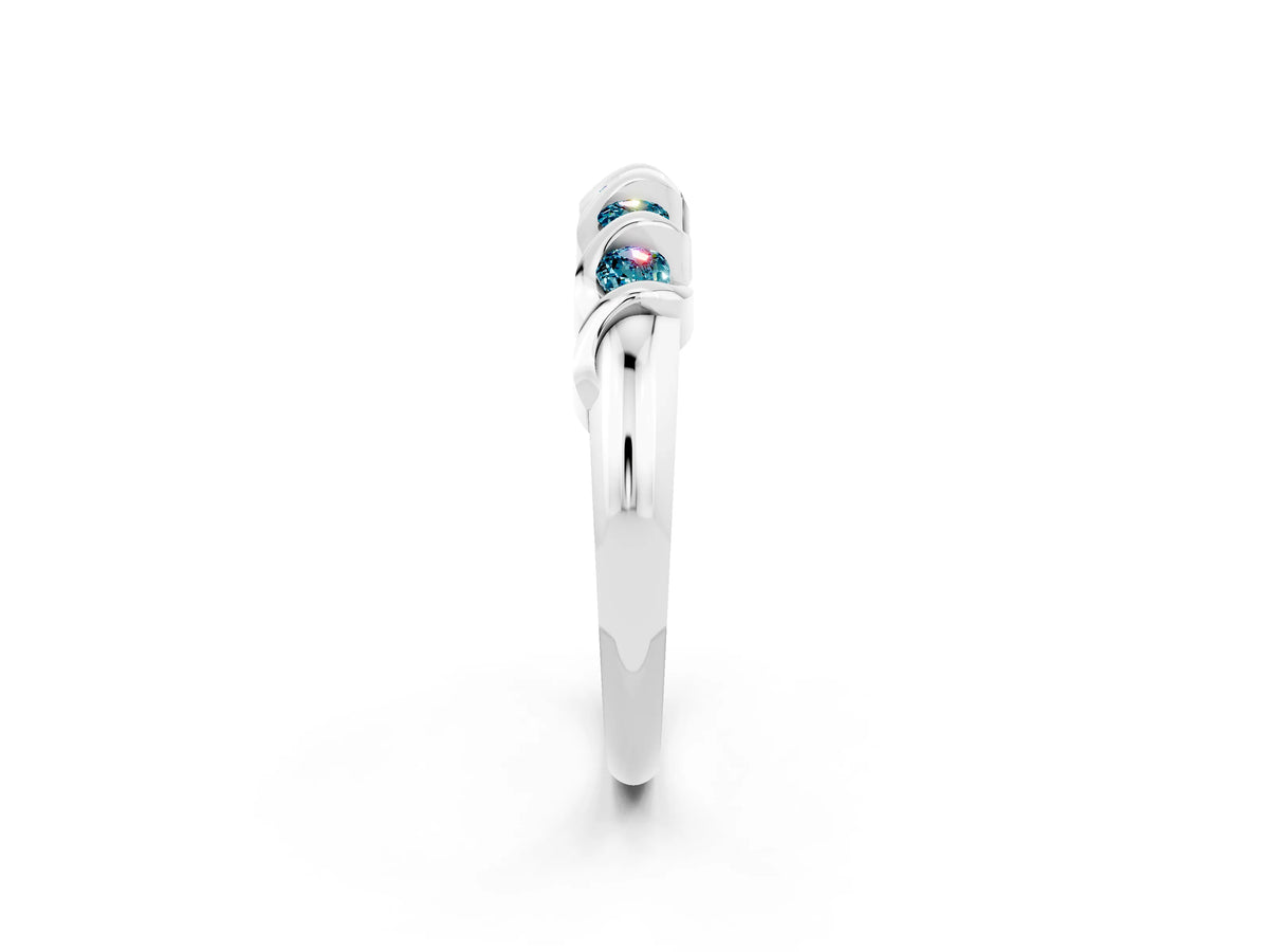 Round Blue Topaz Eternity Band in Silver with Twist Prong Setting