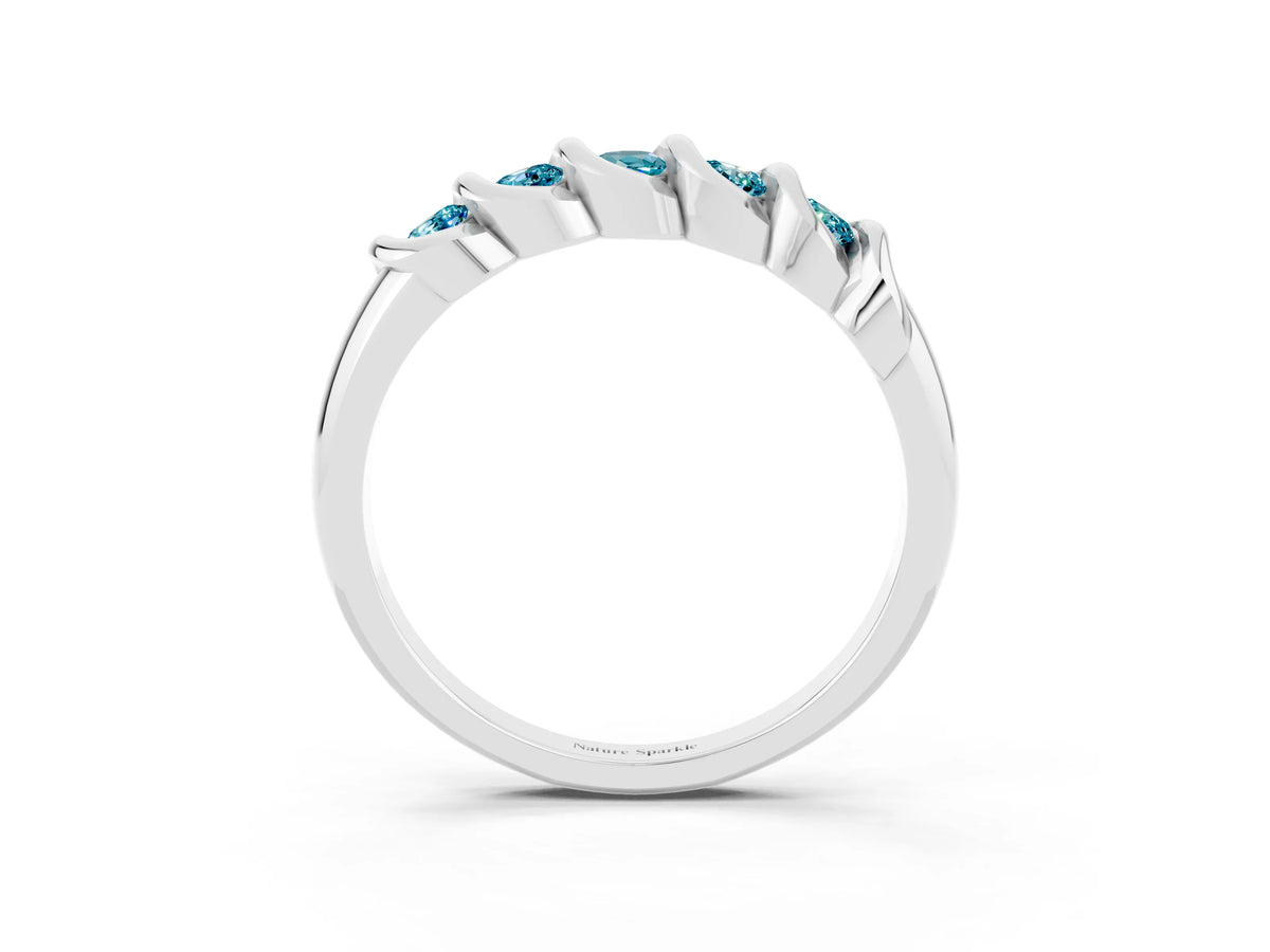 Round Blue Topaz Eternity Band in Silver with Twist Prong Setting