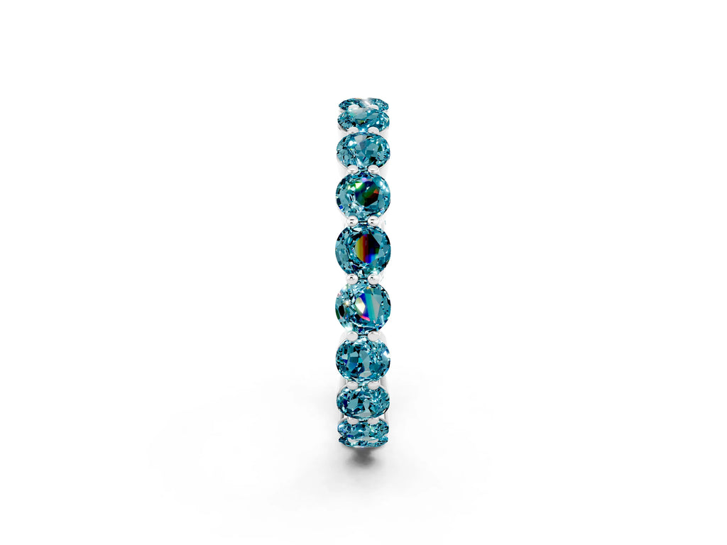 Round Blue Topaz Eternity Band in White gold with U-Prong Setting