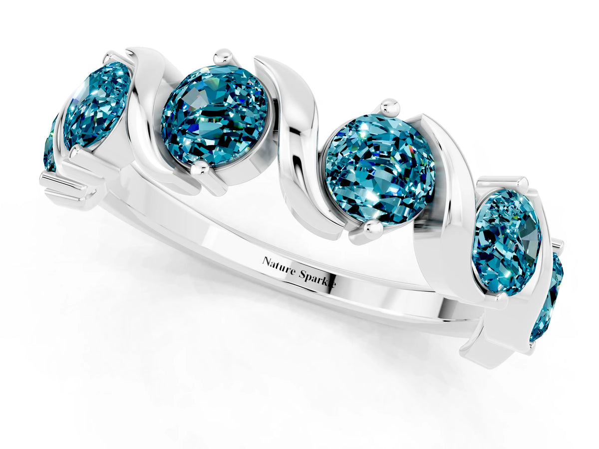 Round Blue Topaz Half Eternity Band in Silver with Wave Prong Setting
