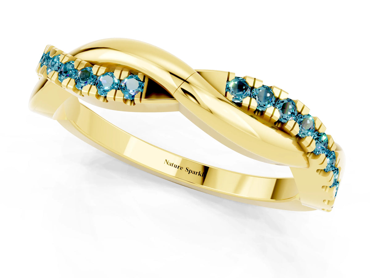 Round Blue Topaz Twisted Infinity Band in Yellow gold with Prong Setting