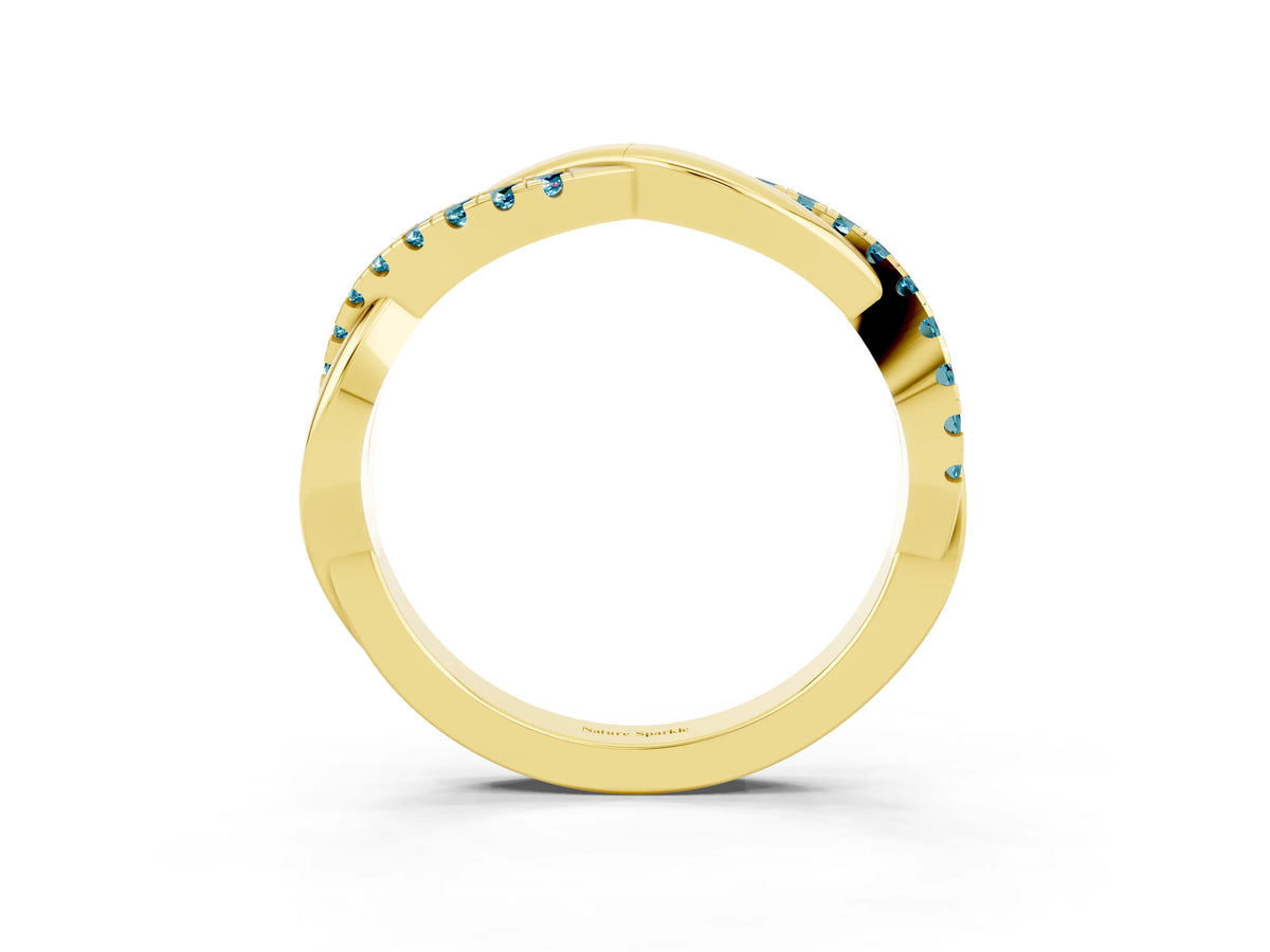 Round Blue Topaz Twisted Infinity Band in Yellow gold with Prong Setting