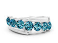 Round Blue Topaz Wave Band in Silver with Channel and Shared Prong Setting