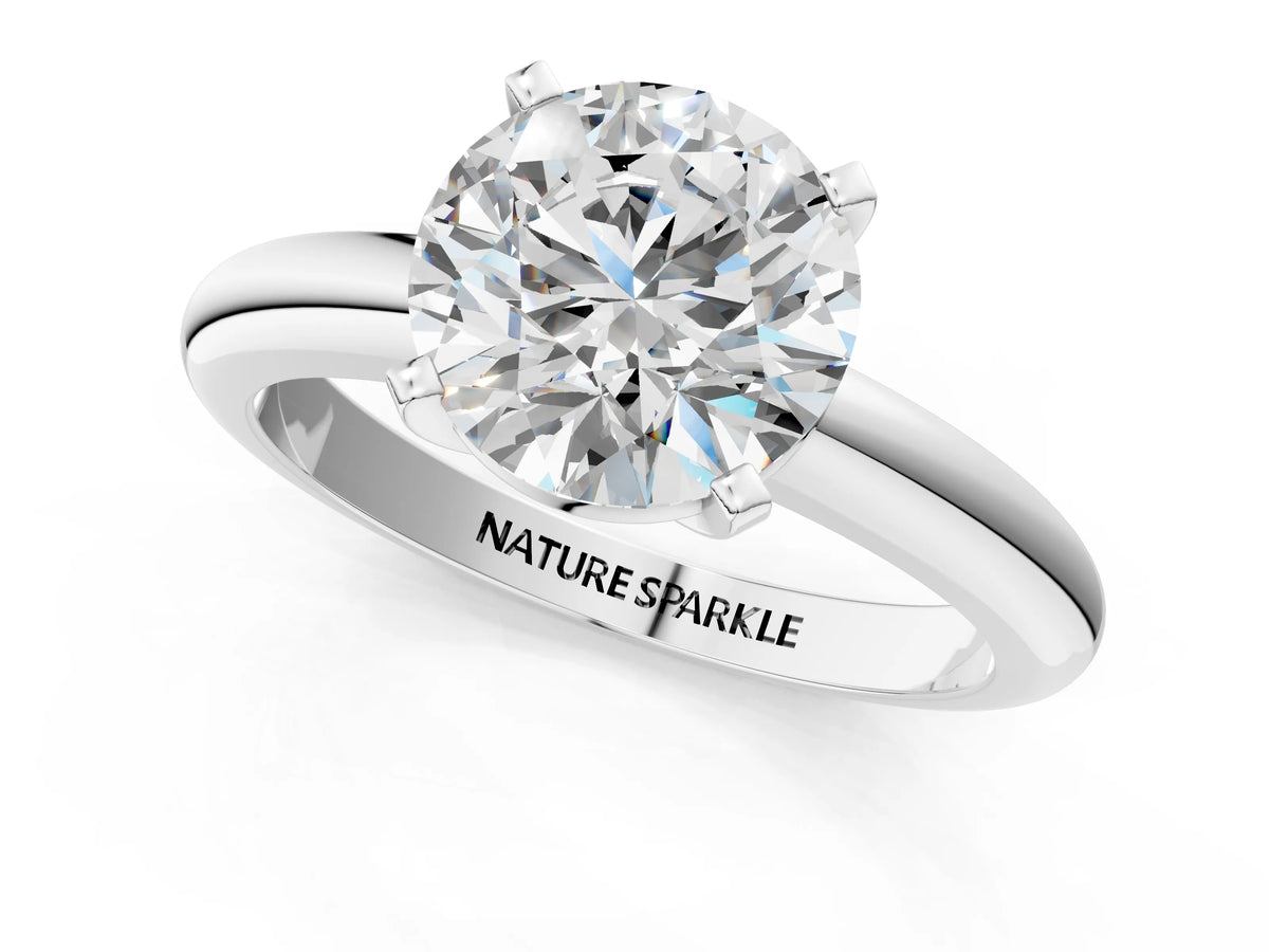 Round Cut Diamond Solitaire Ring in White gold with Prong Setting and Rounded Band