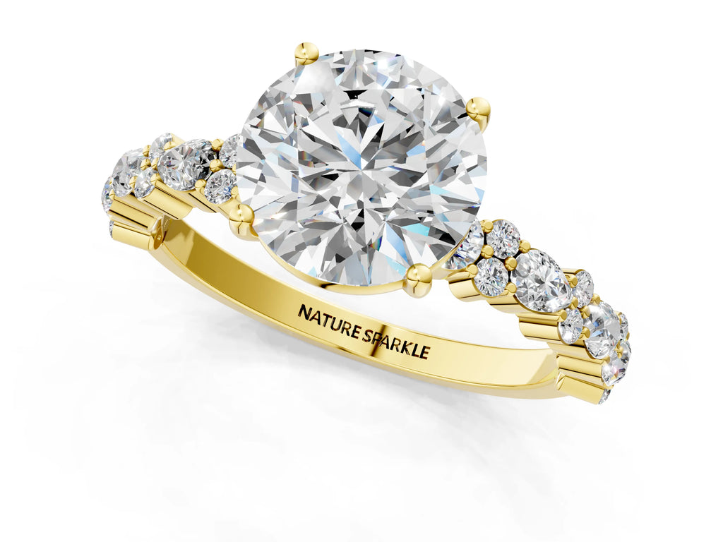 Round Cut Diamond Solitaire Ring in Yellow gold with Pear and Round Cluster Band