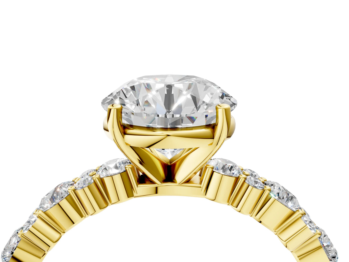 Round Cut Diamond Solitaire Ring in Yellow gold with Pear and Round Cluster Band