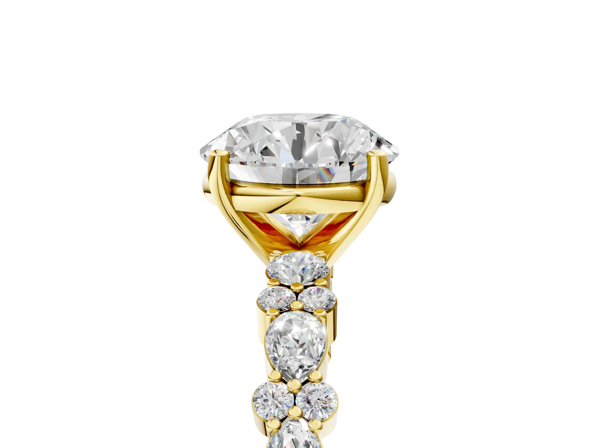 Round Cut Diamond Solitaire Ring in Yellow gold with Pear and Round Cluster Band