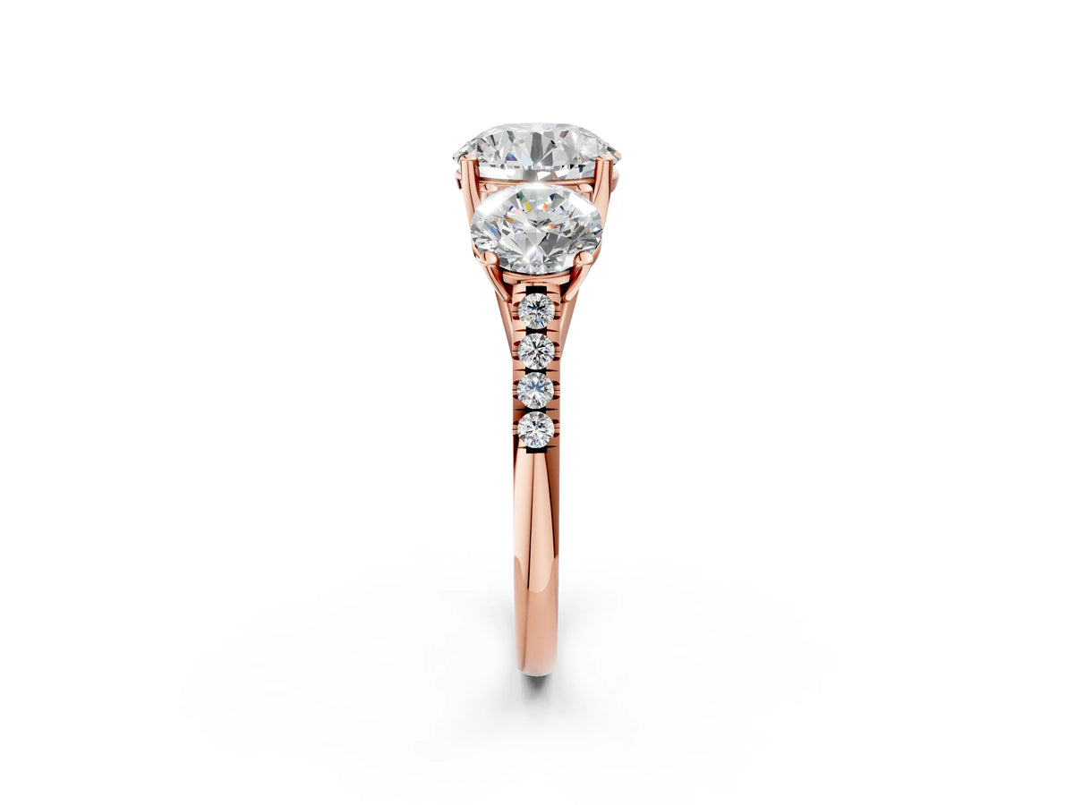 Round Cut Diamond Trellis Three-Stone Engagement Ring in Rose gold with Round Side Stones