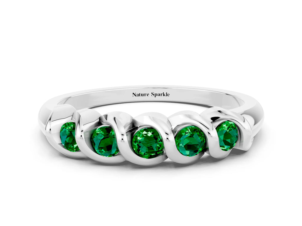 Round Emerald Eternity Band in Platinum with Twist Prong Setting