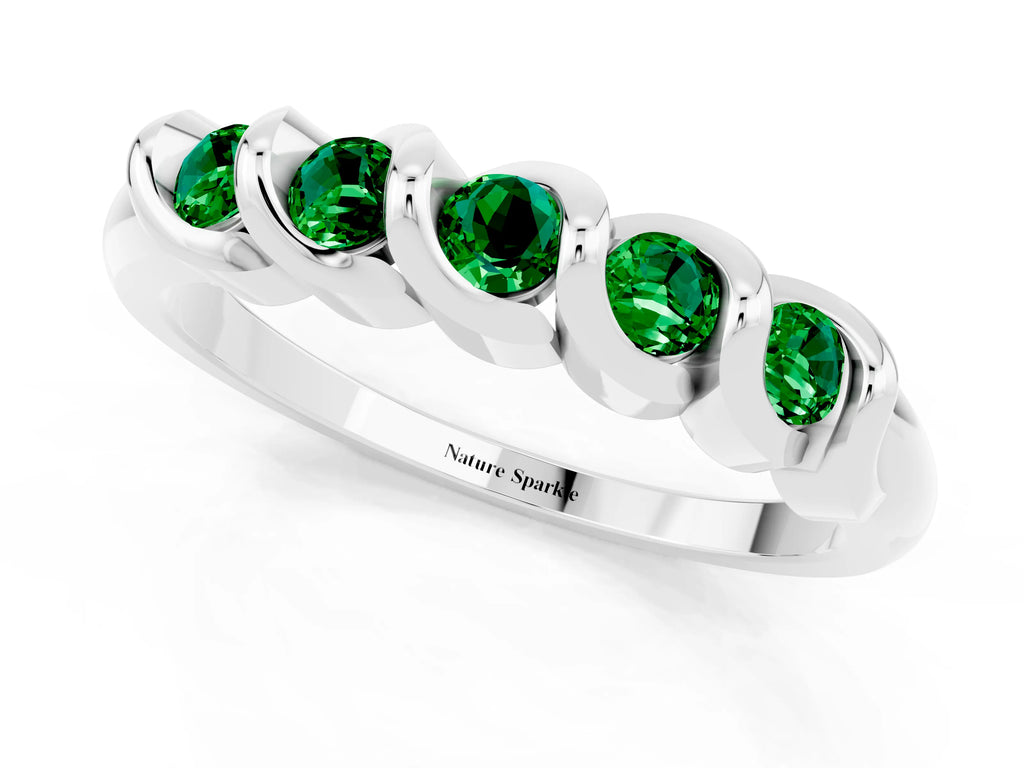 Round Emerald Eternity Band in Platinum with Twist Prong Setting