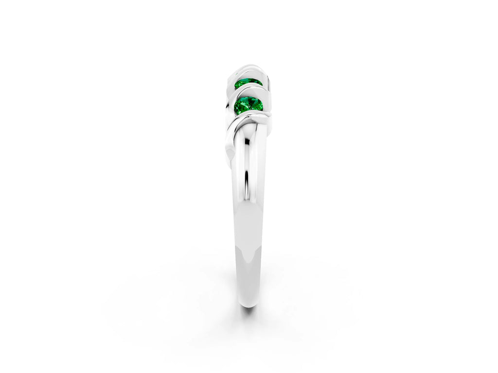 Round Emerald Eternity Band in Platinum with Twist Prong Setting