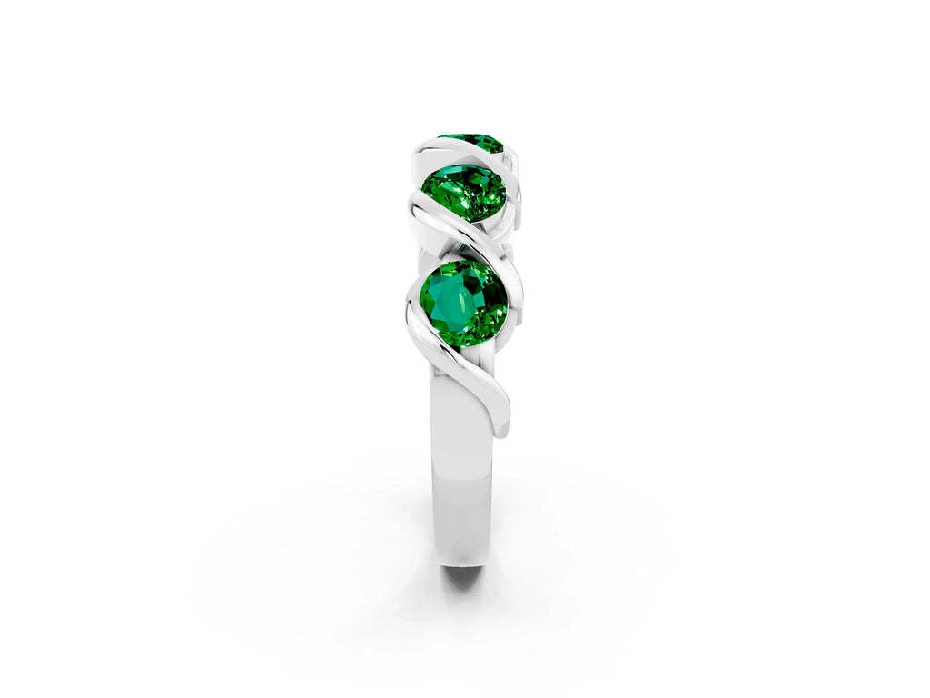 Round Emerald Wave Band in White gold with Channel Setting and Shared Prongs