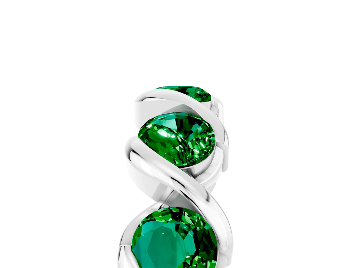 Round Emerald Wave Band in White gold with Channel Setting and Shared Prongs