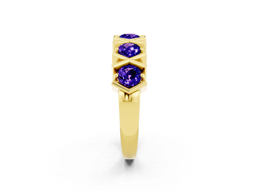 Round Tanzanite Channel Set Band in Yellow gold with X-Prong Detail