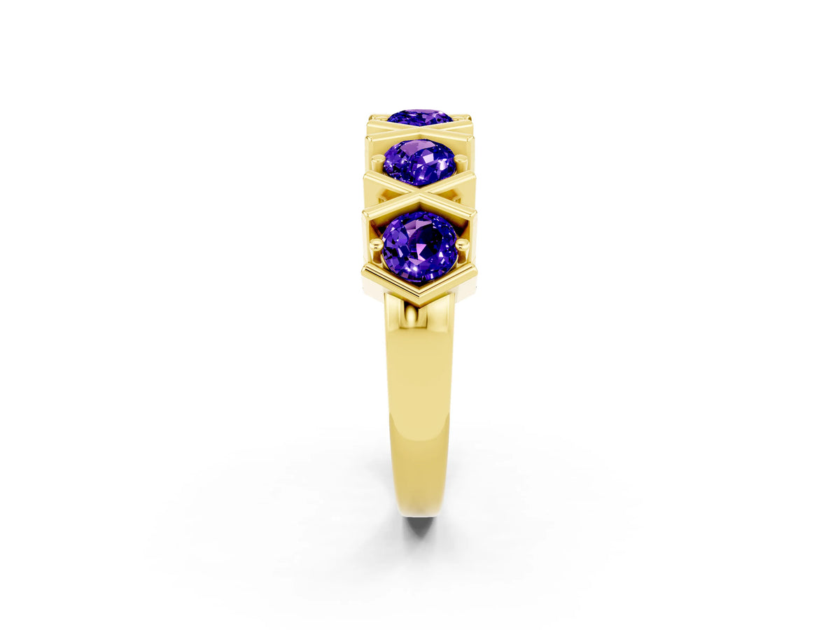 Round Tanzanite Channel Set Band in Yellow gold with X-Prong Detail