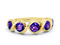 Round Tanzanite Wave Band in Yellow gold with Channel Setting and Shared Prongs