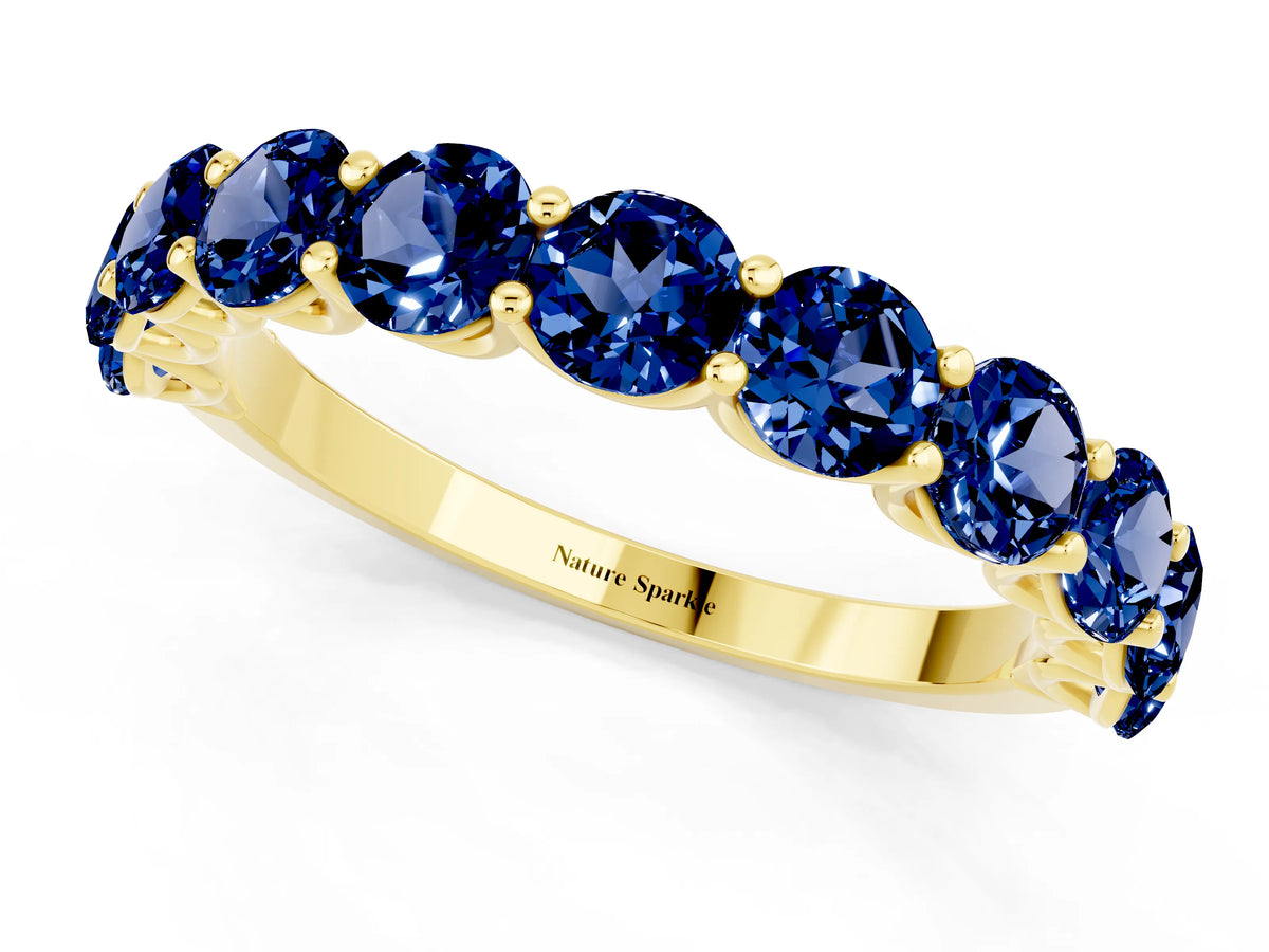 Shared Prong Round Blue Sapphire Eternity Band in Yellow gold with Continuous Circle
