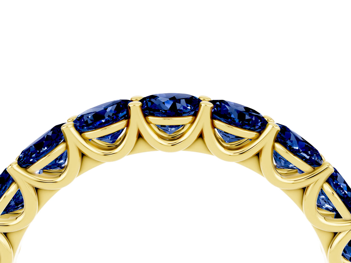 Shared Prong Round Blue Sapphire Eternity Band in Yellow gold with Continuous Circle