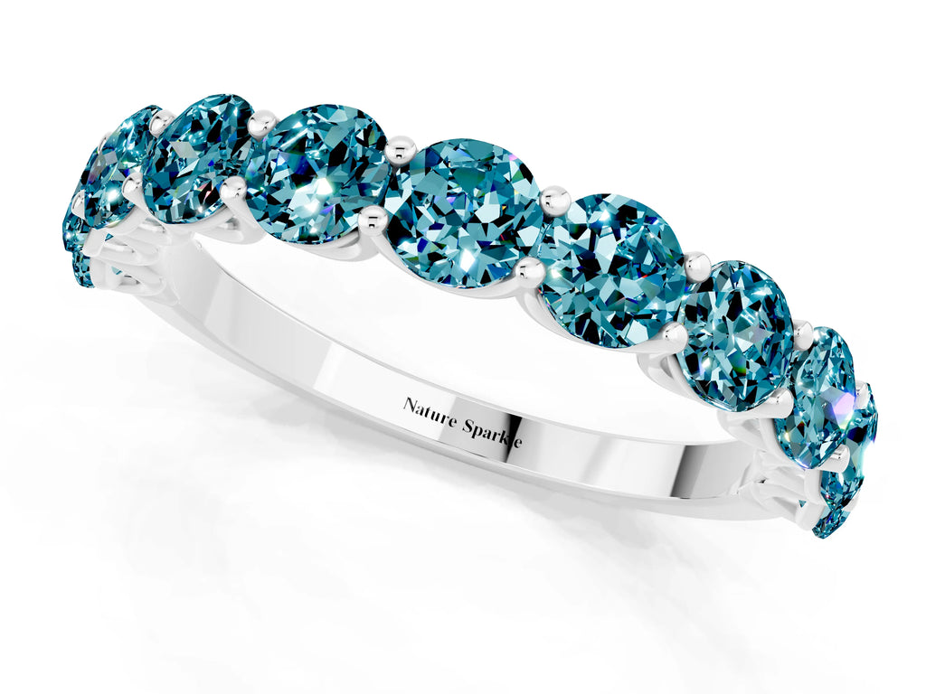 Shared Prong Round Blue Topaz Eternity Band in White gold with Continuous Circle