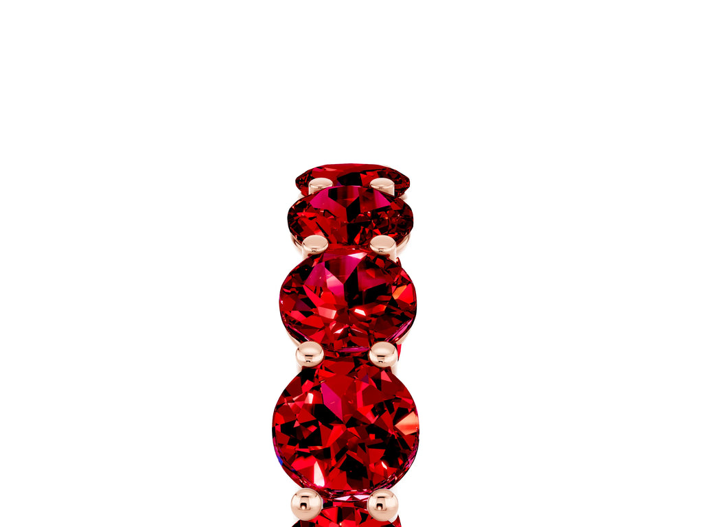 Shared Prong Round Ruby Eternity Band in Rose gold with Continuous Circle