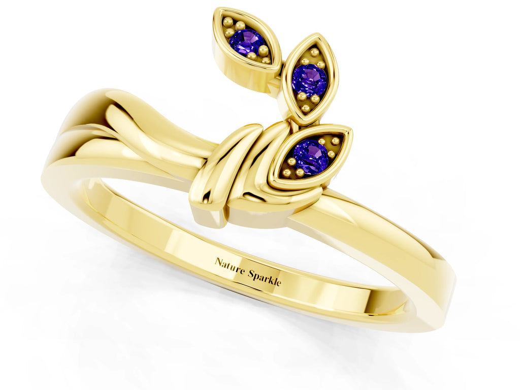 Three-Stone Round Tanzanite Leaf Bypass Ring in Yellow gold with Bezel Setting